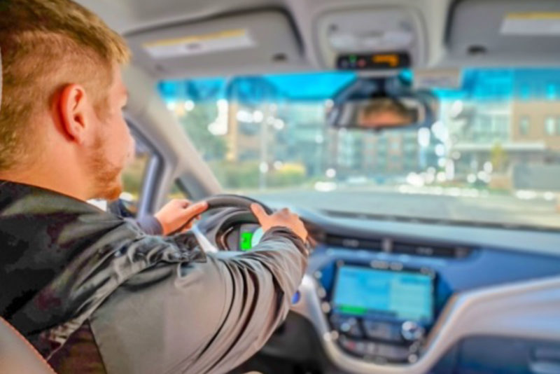 person driving an electric car